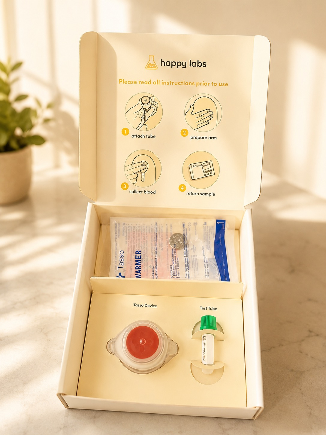 Hands opening a Happy Labs at-home lab kit box