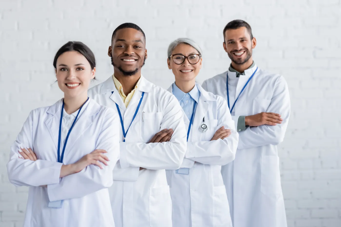 smiling-medical-team-wearing-white-coats-in-hospit-2026-03-12-22-39-43-utc